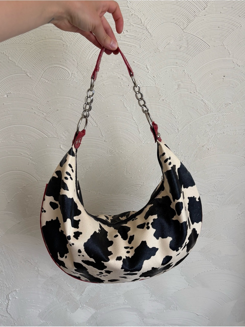 Cow-Print Black & Cream Hobo Bag with Red Trim